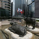 Two water buffalo sculptures by British artist Elisabeth Frink are seen outside Exchange Square business tower where the Hong Kong Stock Exchange is located